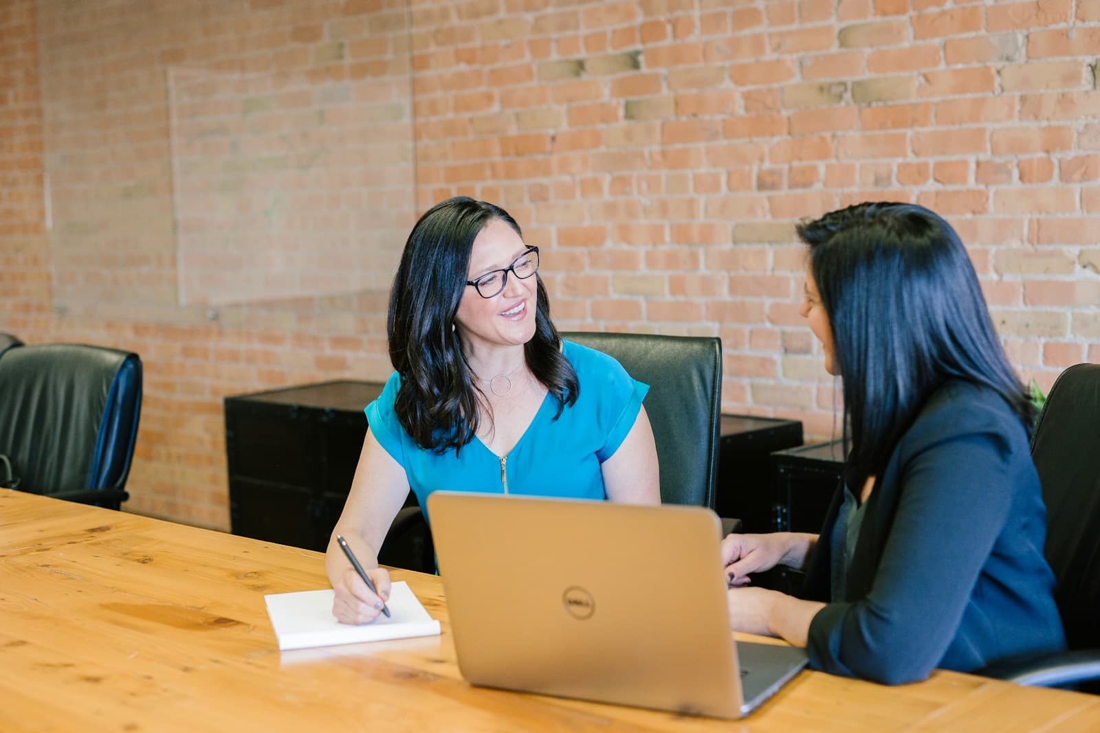 A professional adviser meeting privately with a client